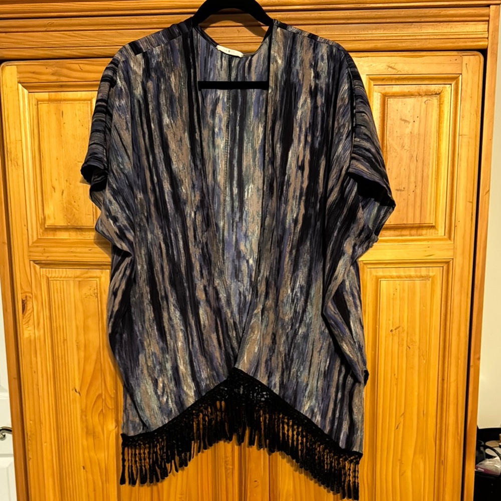 Classy Kimono
Black, blue, purple, tan washed look striped design.
